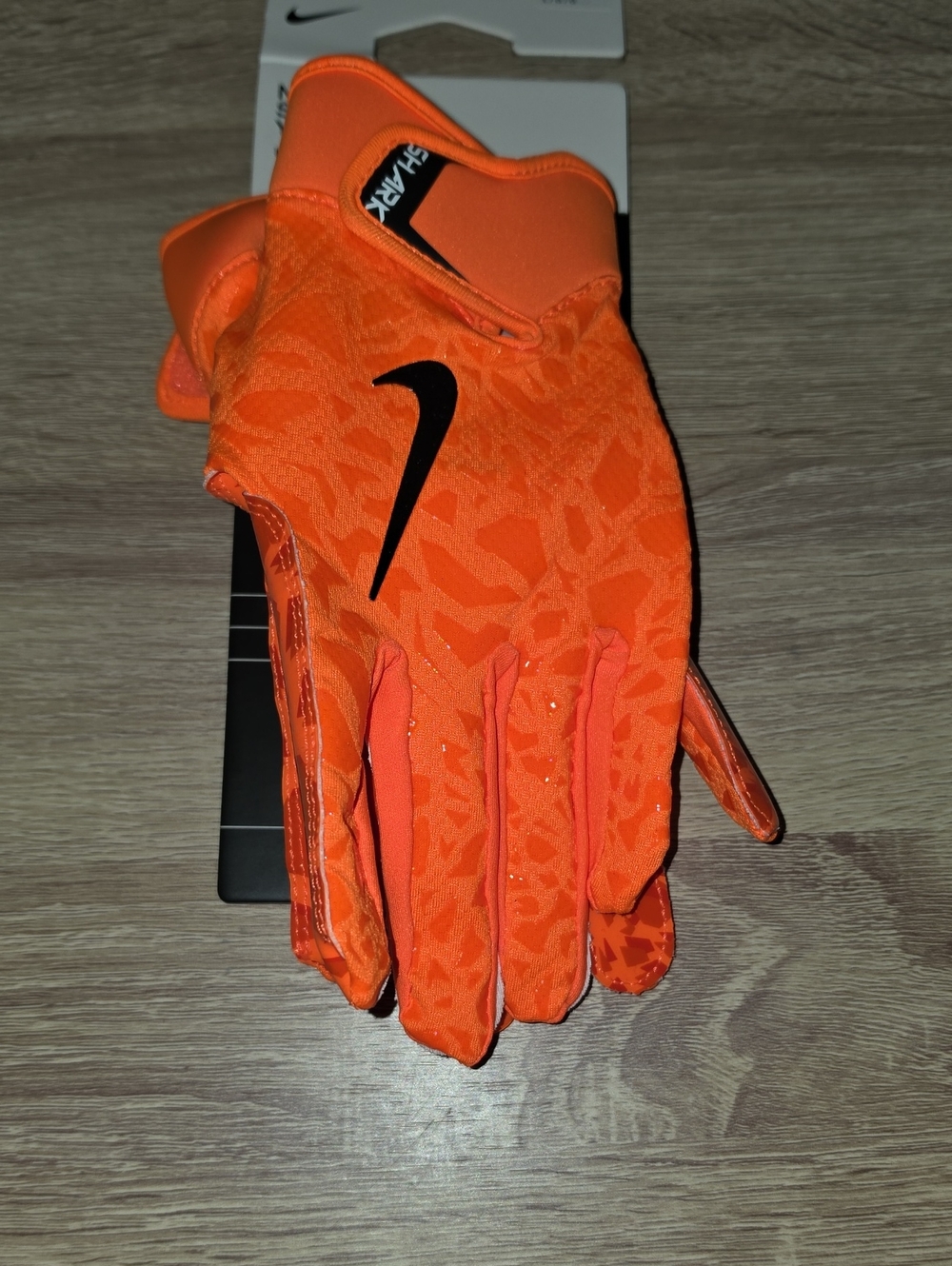 Nike Youth Bright Orange Football Gloves with Black Swoosh